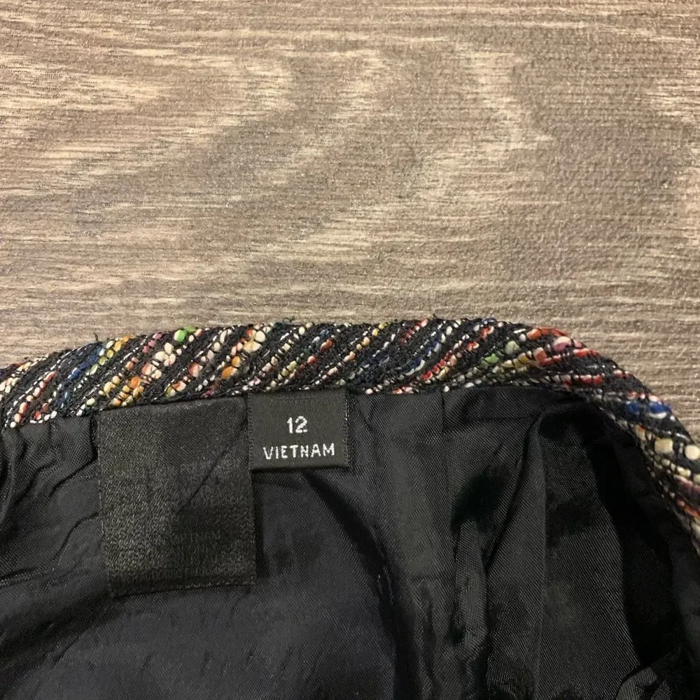 Tahari pencil skirt.  Size: 12. Small slit on back. Metallic thread throughout.